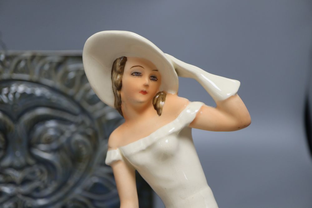 A proctor wall plaque, a Bretby Art Pottery vase and a Czech pottery figure of a lady, height 29cm